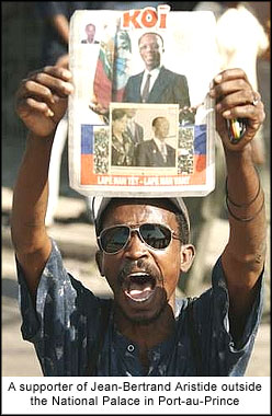 A supporter of Jean-Bertrand Aristide outside the National Palace in Port-au-Prince