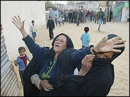 The mother of one of the three members of Al-Sumairy family, who were killed by Israeli occupation soldiers in Dair El-Balah, Gaza Strip, during the funeral.