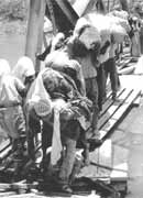 Refugees flee across the Jordan river, 1967.  In successive phases since 1948, more than a million Palestinians have been forced from their cities and villages.